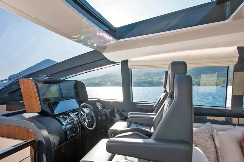 Slide: The Image of Luxurious interior of 2023 Lazzara LSX 67 yacht with panoramic windows and modern helm. - 15