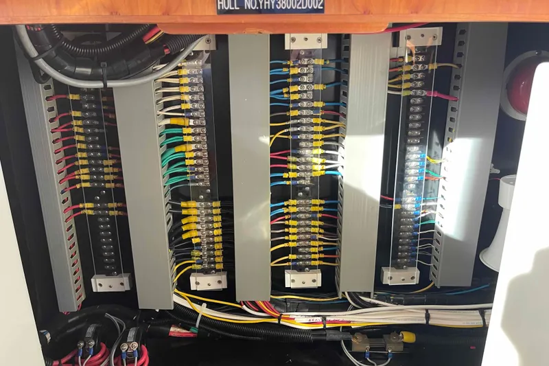 Slide: The Image of Electrical panel of a 2002 President Trawler with organized wiring and connectors. - 46