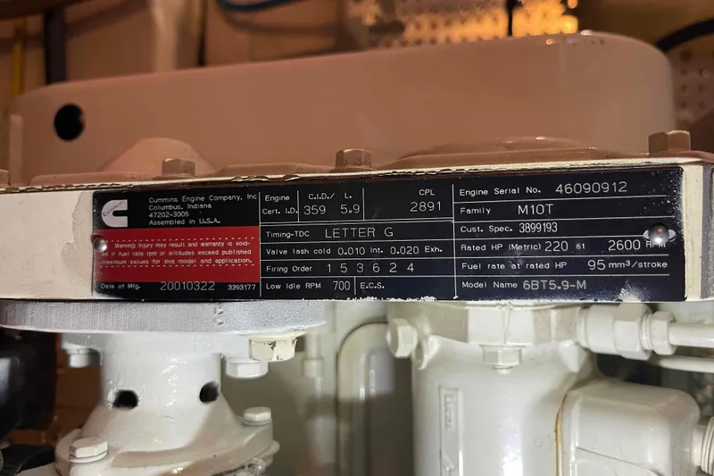 Slide: The Image of Cummins engine label on a 2002 President Trawler, model 6BT5.9-M, with specifications. - 107