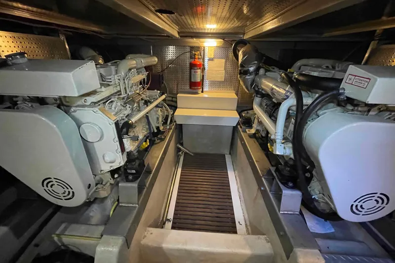 Slide: The Image of Engine room of a 2002 President Trawler with dual engines and fire extinguisher. - 14