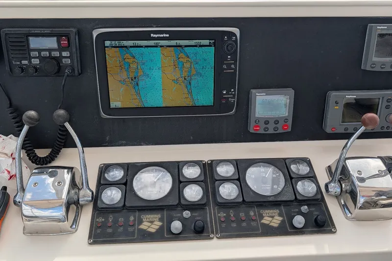Slide: The Image of Control panel of a 2002 President Trawler with navigation and communication equipment. - 17
