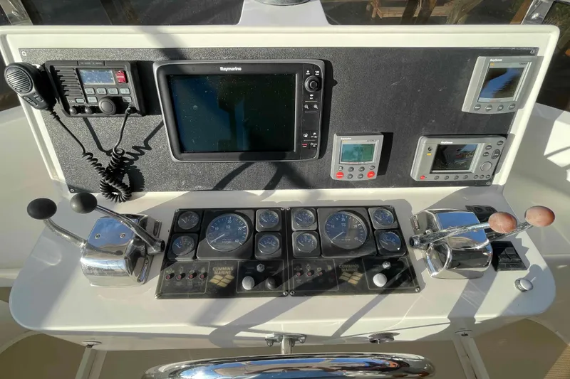 Slide: The Image of Control panel of a 2002 President Trawler with navigation and communication equipment. - 75