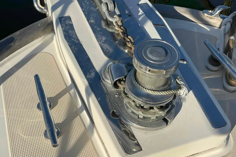 Slide: The Image of Anchor winch on 2002 President Trawler boat deck with ropes and cleats. - 21