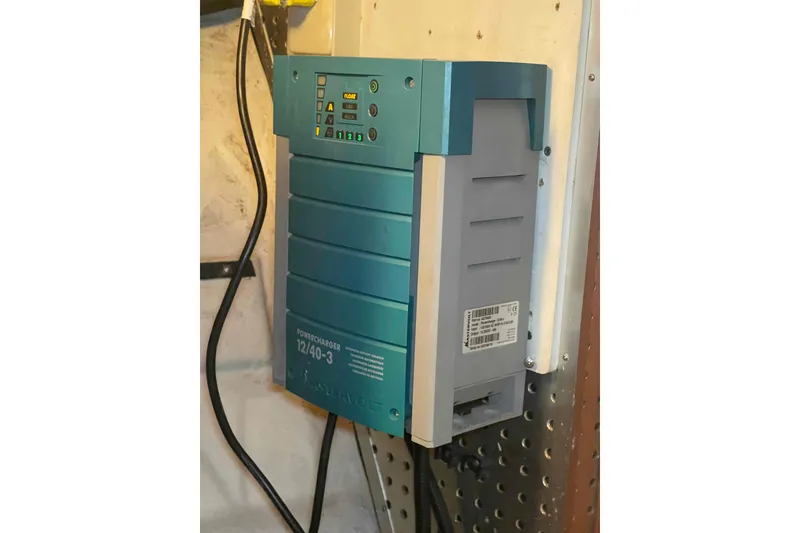 Slide: The Image of Battery charger mounted on a wall inside a 2002 President Trawler boat. - 88