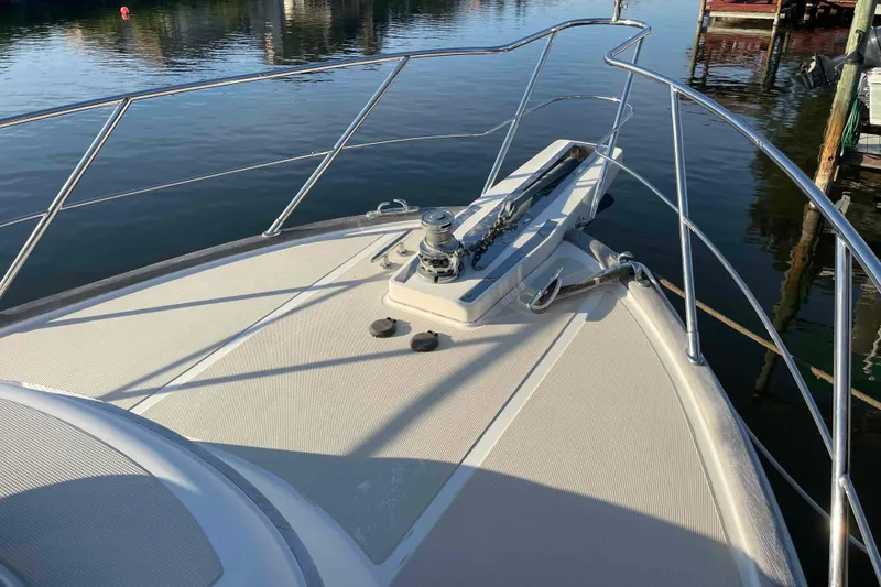 Slide: The Image of Bow of a 2002 President Trawler yacht with stainless steel railings. - 19