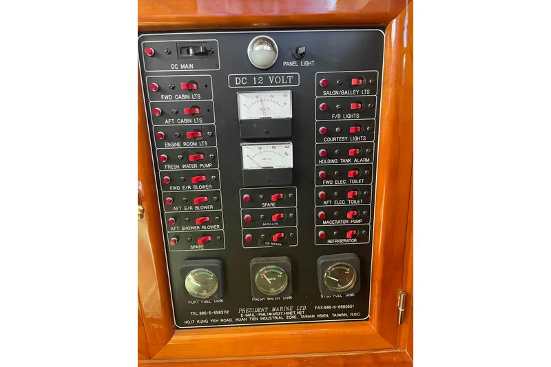 Slide: The Image of Control panel of a 2002 President Trawler with various switches and gauges. - 44