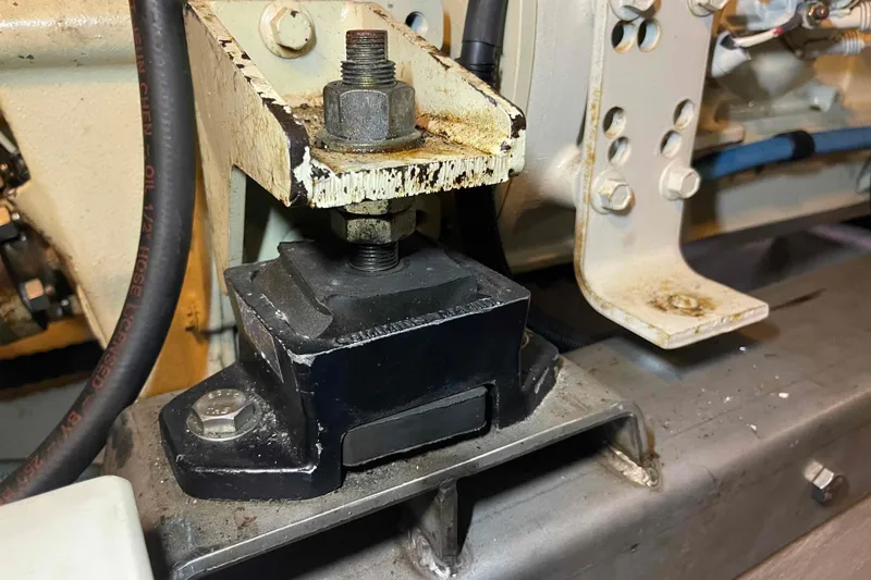 Slide: The Image of Engine mount detail on a 2002 President Trawler, showcasing mechanical components and connections. - 98