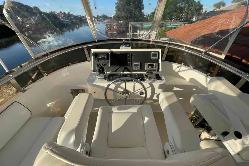 Slide: The Image of Helm of 2002 President Trawler with modern controls and scenic waterway view. - 73