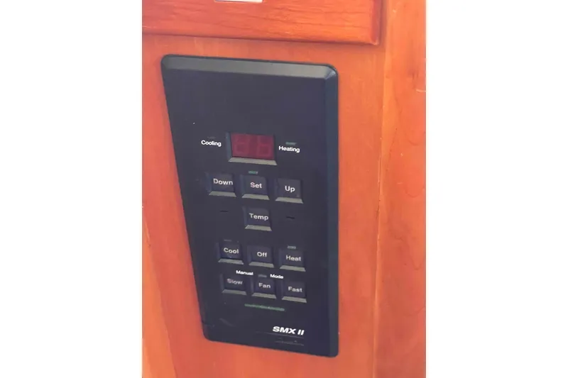 Slide: The Image of Control panel on 2002 President Trawler, featuring temperature and fan settings. - 37