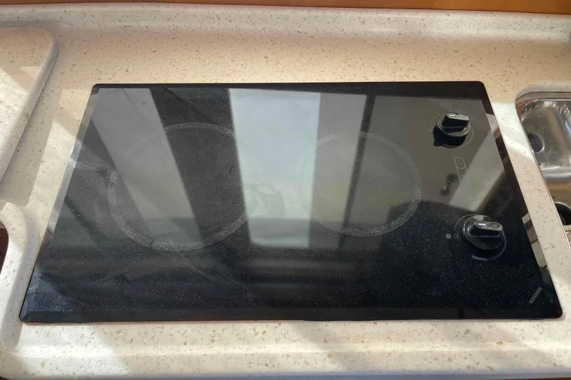 Slide: The Image of Glass stovetop on a 2002 President Trawler yacht kitchen counter. - 56