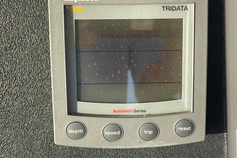 Slide: The Image of Raymarine ST60 Tridata display on 2002 President Trawler, showing depth, speed, and trip functions. - 77