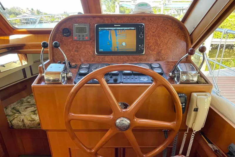 Slide: The Image of Helm of 2002 President Trawler with navigation equipment and wooden steering wheel. - 40