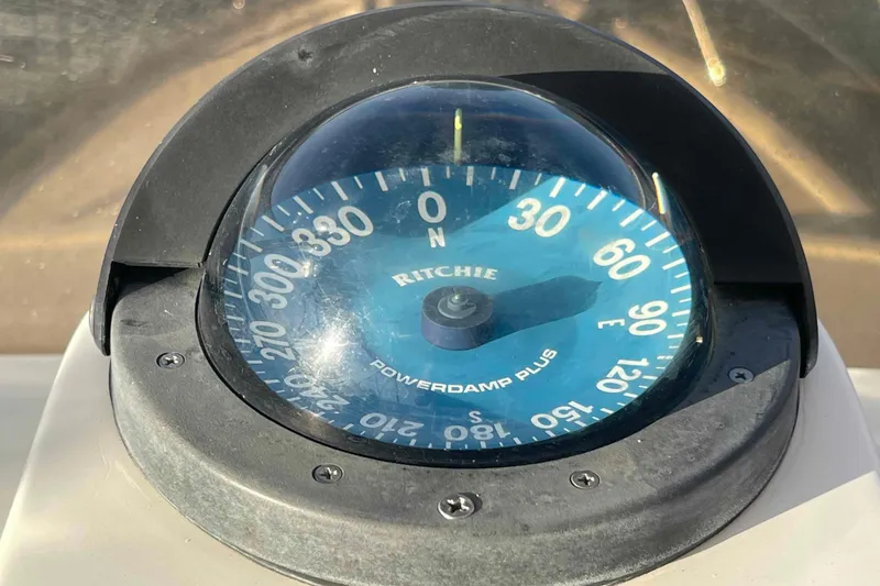 Slide: The Image of Compass on 2002 President Trawler, Ritchie Powerdamp Plus, showing navigation directions. - 78