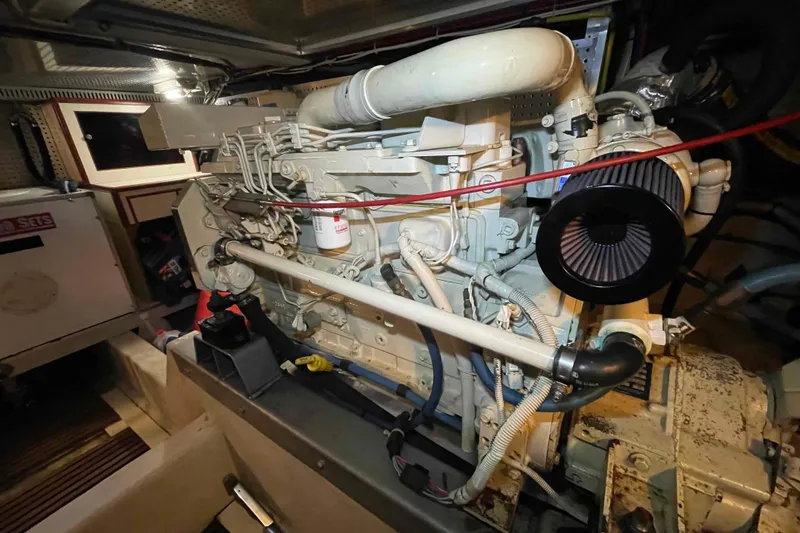 Slide: The Image of Engine room of a 2002 President Trawler, showcasing detailed machinery and components. - 95