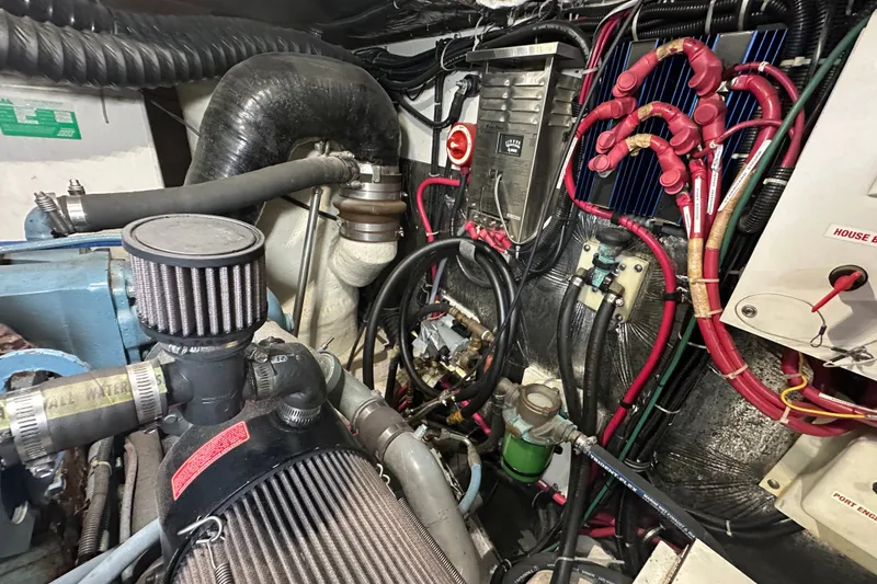 Slide: The Image of Engine room of a 1997 Tiara Yachts 4000 Express, showcasing complex wiring and components. - 45
