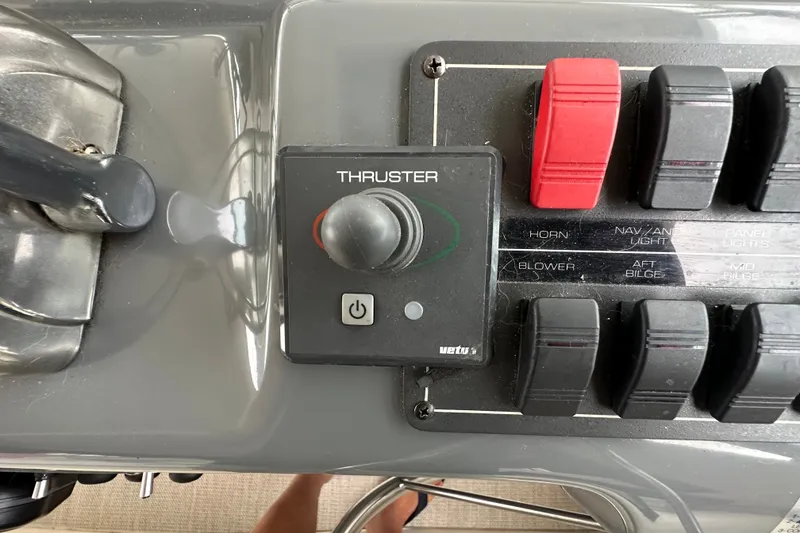Slide: The Image of Control panel of a 1997 Tiara Yachts 4000 Express with thruster and switches. - 39