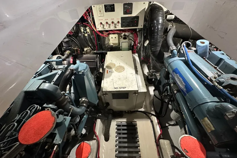 Slide: The Image of Engine room of a 1997 Tiara Yachts 4000 Express, showcasing mechanical components and wiring. - 48