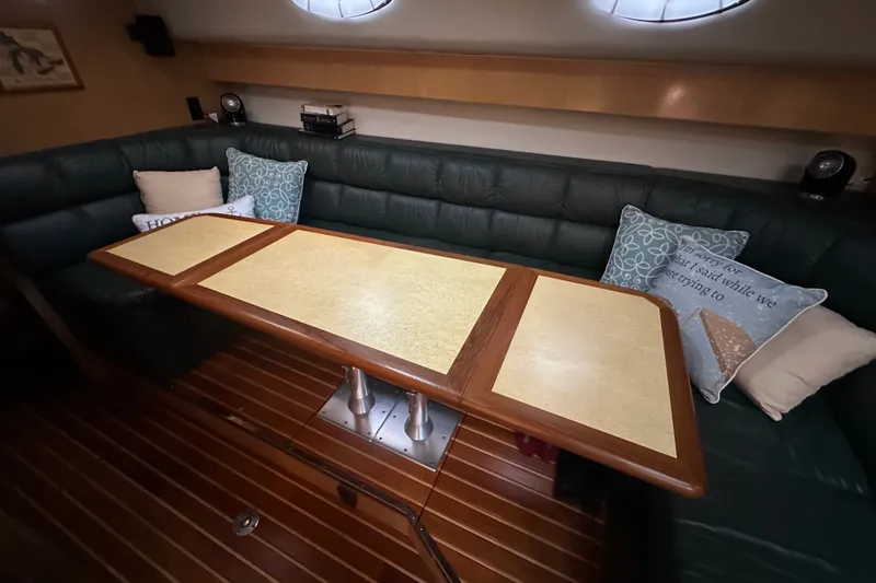 Slide: The Image of Luxurious interior of 1997 Tiara Yachts 4000 Express with elegant seating and table. - 35