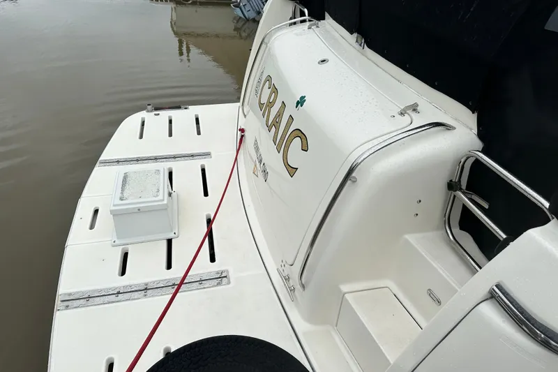 Slide: The Image of 1997 Tiara Yachts 4000 Express boat stern with docked platform and railing. - 9