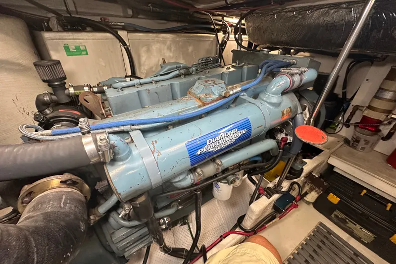 Slide: The Image of Engine room of a 1997 Tiara Yachts 4000 Express, featuring a Diamond Performance Series engine. - 8