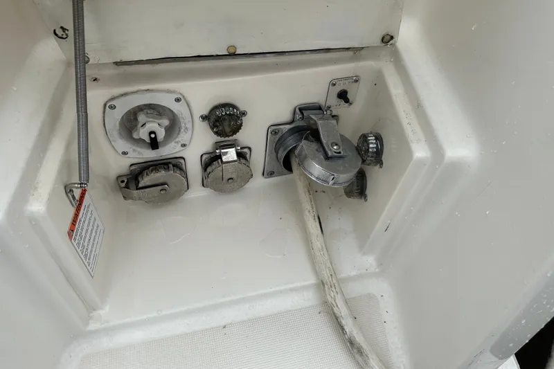 Slide: The Image of 1997 Tiara Yachts 4000 Express utility connections, featuring power and water hookups. - 16