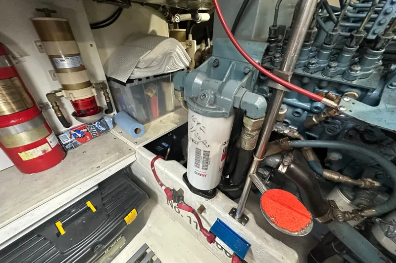 Slide: The Image of Engine room of a 1997 Tiara Yachts 4000 Express, showcasing mechanical components and storage. - 47