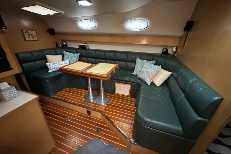 Slide: The Image of Luxurious interior of 1997 Tiara Yachts 4000 Express with green leather seating. - 19