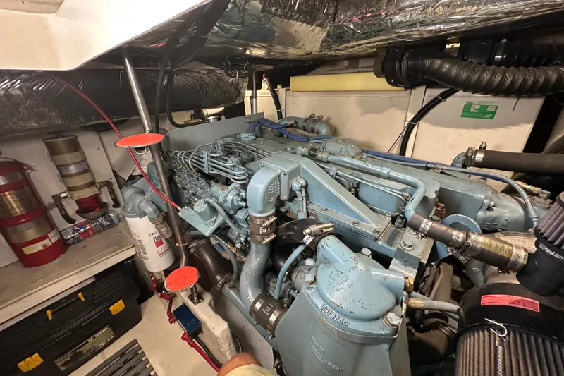 Slide: The Image of Engine room of a 1997 Tiara Yachts 4000 Express, showcasing detailed machinery and components. - 50