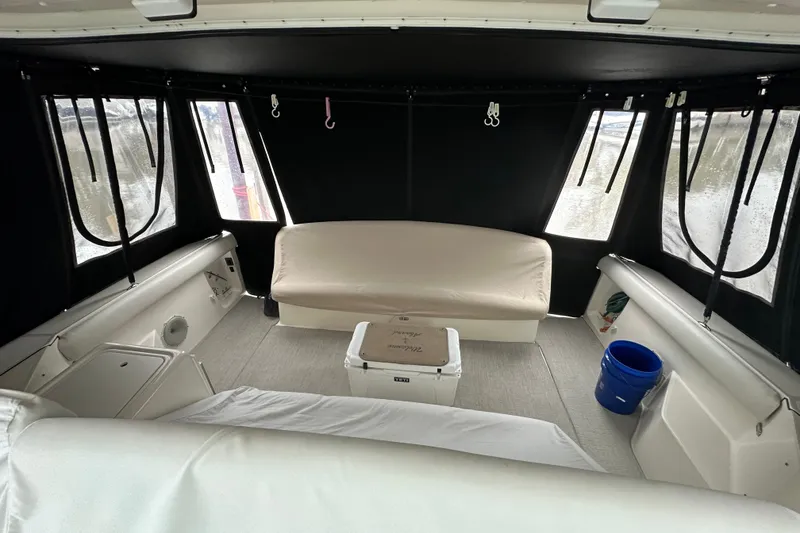 Slide: The Image of Interior of 1997 Tiara Yachts 4000 Express with seating and cooler. - 12