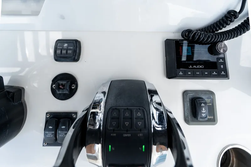 Slide: The Image of 2021 Invincible 39 Open Fisherman boat dashboard with controls and JL Audio system. - 36
