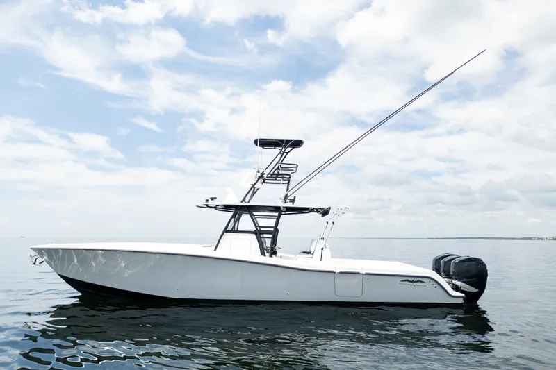 Slide: The Image of 2021 Invincible 39 Open Fisherman boat on calm water under a cloudy sky. - 5