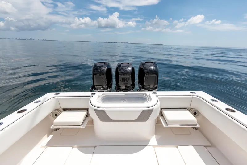 Slide: The Image of 2021 Invincible 39 Open Fisherman boat with triple engines on calm ocean. - 54