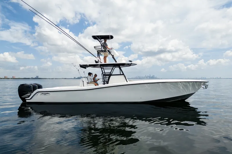 Slide: The Image of 2021 Invincible 39 Open Fisherman boat on calm water under a cloudy sky. - 10