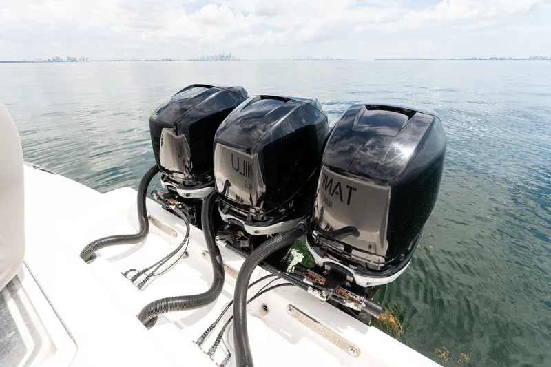 Slide: The Image of Triple outboard engines on a 2021 Invincible 39 Open Fisherman boat. - 24