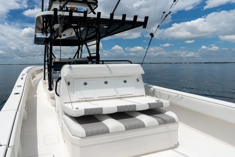 Slide: The Image of 2021 Invincible 39 Open Fisherman boat on calm water under a blue sky. - 25