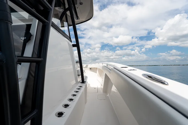Slide: The Image of 2021 Invincible 39 Open Fisherman boat deck with ocean view and blue sky. - 17