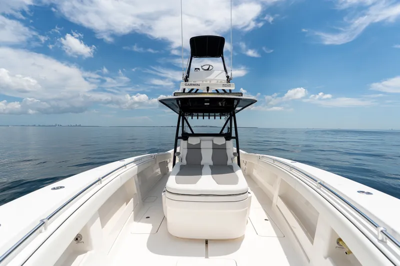 Slide: The Image of 2021 Invincible 39 Open Fisherman boat on calm ocean under blue sky. - 45