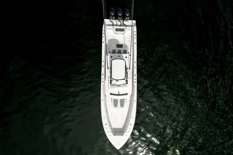 Slide: The Image of Aerial view of 2021 Invincible 39 Open Fisherman boat on dark water. - 3