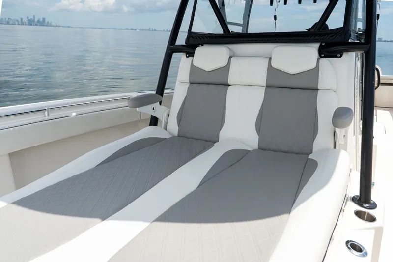Slide: The Image of 2021 Invincible 39 Open Fisherman boat interior with cushioned seating, ocean view. - 47