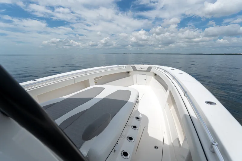 Slide: The Image of 2021 Invincible 39 Open Fisherman boat on calm sea under a partly cloudy sky. - 18