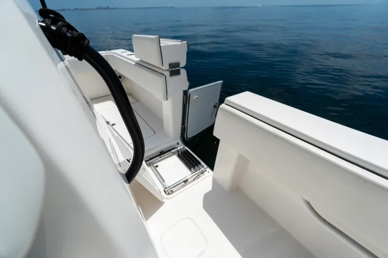 Slide: The Image of 2021 Invincible 39 Open Fisherman boat deck with open hatch and ocean view. - 30
