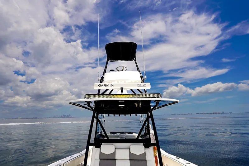 Slide: The Image of Invincible 39 Open Fisherman boat on calm sea under a vibrant blue sky, 2021 model. - 52