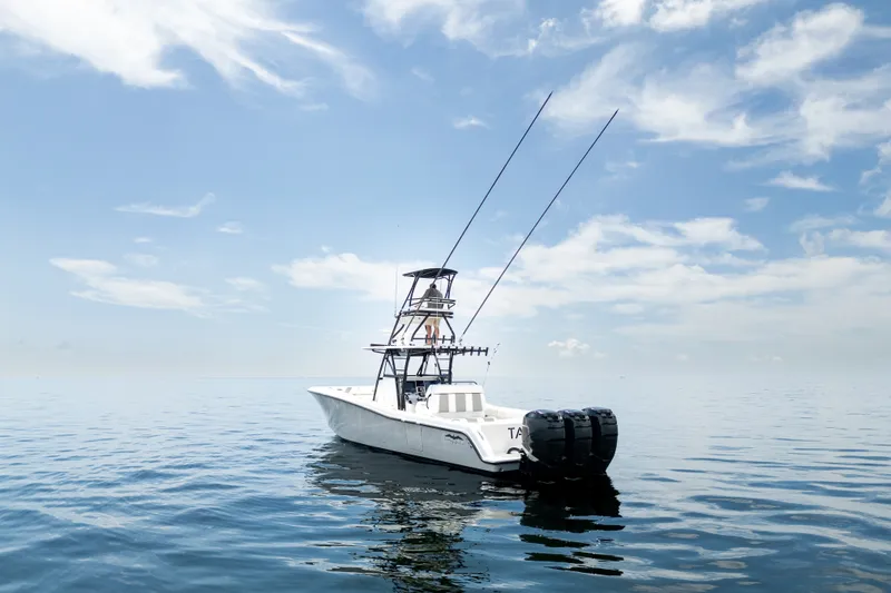 Slide: The Image of 2021 Invincible 39 Open Fisherman boat on calm ocean under blue sky. - 7