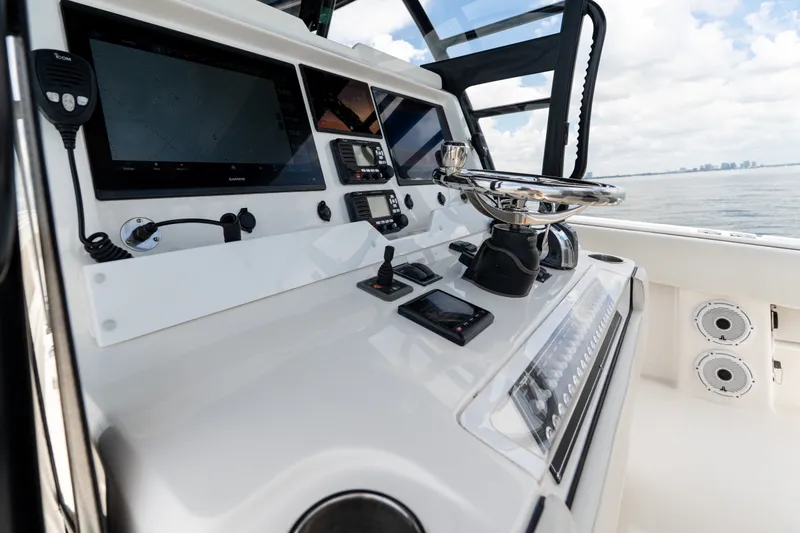 Slide: The Image of Control panel of 2021 Invincible 39 Open Fisherman boat with navigation equipment. - 14