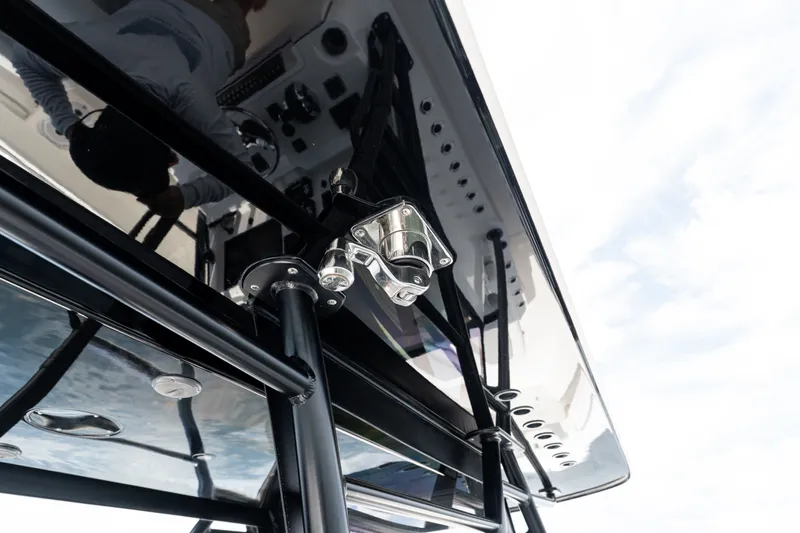Slide: The Image of 2021 Invincible 39 Open Fisherman boat with sleek black T-top and mounted equipment. - 31