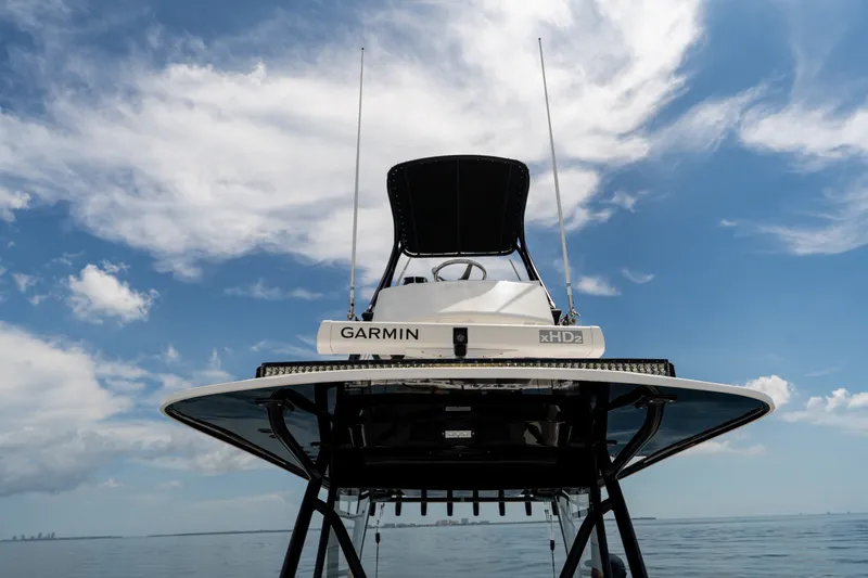 Slide: The Image of 2021 Invincible 39 Open Fisherman boat with Garmin xHD2 radar under a clear blue sky. - 46
