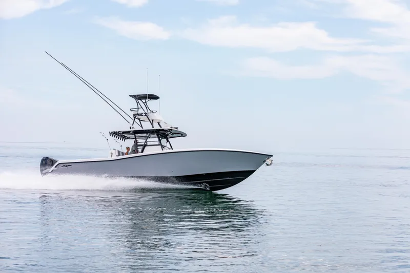Slide: The Image of 2021 Invincible 39 Open Fisherman boat cruising on calm ocean waters. - 62