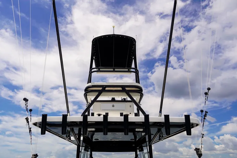Slide: The Image of 2021 Invincible 39 Open Fisherman boat against a cloudy sky backdrop. - 37