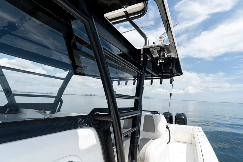 Slide: The Image of 2021 Invincible 39 Open Fisherman boat on calm sea under blue sky. - 50