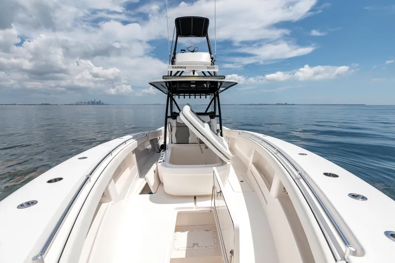 Slide: The Image of 2021 Invincible 39 Open Fisherman boat on calm ocean under blue sky. - 57